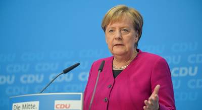 Меркель пообещала лоббировать санкции против РФ